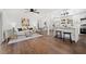 An open-concept living space with a kitchen, dining, and living area, featuring modern decor and hardwood floors at 2277 Cloverdale Se Dr, Atlanta, GA 30316
