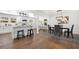 Open floor plan with kitchen island, dining space, and stools at counter at 2277 Cloverdale Se Dr, Atlanta, GA 30316