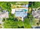 An aerial view of the house, pool, patio, and lush landscaping around the property at 2903 Ashebrooke Ne Dr, Marietta, GA 30068