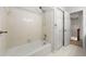 Clean white tiled bathroom with shower-tub and large closet at 2903 Ashebrooke Ne Dr, Marietta, GA 30068