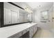 Bathroom with large mirror, double sinks, and updated fixtures at 2903 Ashebrooke Ne Dr, Marietta, GA 30068