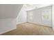 Carpeted bedroom with window and an angled ceiling at 2903 Ashebrooke Ne Dr, Marietta, GA 30068