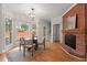 Cozy dining nook with fireplace, hardwood floors, and large windows providing natural light at 2903 Ashebrooke Ne Dr, Marietta, GA 30068