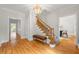 Inviting foyer with hardwood floors, staircase, and elegant chandelier, perfect for a grand entrance at 2903 Ashebrooke Ne Dr, Marietta, GA 30068