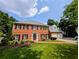 Beautiful two-story brick home with a lush green lawn and a two-car garage at 2903 Ashebrooke Ne Dr, Marietta, GA 30068