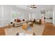 Bright living room featuring a neutral color palette, natural light, and a decorative ceiling fan at 2903 Ashebrooke Ne Dr, Marietta, GA 30068