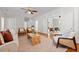 Open living room showcasing wood floors, white trim, and natural light filtering through the windows at 2903 Ashebrooke Ne Dr, Marietta, GA 30068