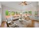 Light-filled living room with multiple windows and views of the backyard and pool at 2903 Ashebrooke Ne Dr, Marietta, GA 30068