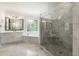 Bright bathroom features marble floors, tub, sink, and a spacious glass shower at 2903 Ashebrooke Ne Dr, Marietta, GA 30068