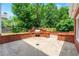 Brick-enclosed outdoor kitchen and patio area provides an ideal space for Gathering gatherings at 2903 Ashebrooke Ne Dr, Marietta, GA 30068