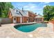 Backyard pool with flagstone surround and privacy fence offers a serene escape at 2903 Ashebrooke Ne Dr, Marietta, GA 30068