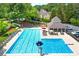 Community pool featuring a diving board, lounge chairs, sun umbrellas, and a covered pavilion at 2903 Ashebrooke Ne Dr, Marietta, GA 30068