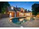 Backyard pool and manicured landscaping at dusk at 2903 Ashebrooke Ne Dr, Marietta, GA 30068