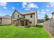 The beautiful backyard features a lush lawn, perfect for outdoor activities and relaxation, and a covered patio at 7946 White Oak Loop, Stonecrest, GA 30038