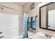 Well-maintained bathroom with a tub, shower, and vanity with blue accents at 7946 White Oak Loop, Stonecrest, GA 30038