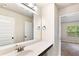 Bathroom with large mirror and view into bedroom at 7946 White Oak Loop, Stonecrest, GA 30038