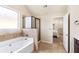 Modern bathroom with a shower stall, tub, and tile flooring at 7946 White Oak Loop, Stonecrest, GA 30038