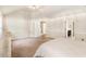 Spacious bedroom with a private bathroom and a connecting hallway at 7946 White Oak Loop, Stonecrest, GA 30038