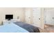 This bedroom is furnished with a bed and a dresser at 7946 White Oak Loop, Stonecrest, GA 30038