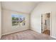 Bright bedroom with neutral walls, plush carpet, featuring an ensuite bathroom at 7946 White Oak Loop, Stonecrest, GA 30038