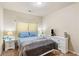 Cozy bedroom with a comfortable bed, nightstands, and dresser at 7946 White Oak Loop, Stonecrest, GA 30038