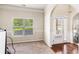 Inviting entryway with natural light, hardwood floors, and access to the front door at 7946 White Oak Loop, Stonecrest, GA 30038