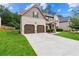 Beautiful home with a lush lawn and a two car garage, showcasing its well-maintained exterior at 7946 White Oak Loop, Stonecrest, GA 30038