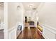 Elegant hallway with hardwood floors, leading to a living room with a fireplace and comfortable seating at 7946 White Oak Loop, Stonecrest, GA 30038