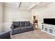 Comfortable living room with tray ceiling, fireplace and views to kitchen at 7946 White Oak Loop, Stonecrest, GA 30038