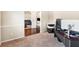Open-concept living space with neutral colors, wood floors, and a seamless transition to the Gathering room at 7946 White Oak Loop, Stonecrest, GA 30038