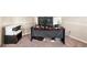 Office space with a desk and multiple monitors, alongside a printer for a functional work area at 7946 White Oak Loop, Stonecrest, GA 30038
