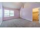 Bedroom with vaulted ceiling, window, and walk-in closet, ready to be personalized at 1022 Nestling Dr, Lawrenceville, GA 30045