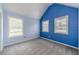 Bedroom with blue accent wall and multiple windows offering ample natural light at 1022 Nestling Dr, Lawrenceville, GA 30045