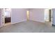 Spacious bedroom showcasing ensuite bathroom and ample natural light at 1022 Nestling Dr, Lawrenceville, GA 30045