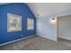 Bedroom with blue accent wall and natural light offers a cozy atmosphere at 1022 Nestling Dr, Lawrenceville, GA 30045