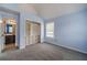 Cozy bedroom showcasing an ensuite bathroom and closet space at 1022 Nestling Dr, Lawrenceville, GA 30045