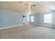 Bonus room with vaulted ceiling, ceiling fan and neutral carpet at 1022 Nestling Dr, Lawrenceville, GA 30045