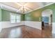A dining room featuring dark hardwood floors, decorative molding, and a coffered ceiling at 1022 Nestling Dr, Lawrenceville, GA 30045