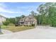Beautiful two-story home with brick facade, manicured lawn, and a long driveway at 1022 Nestling Dr, Lawrenceville, GA 30045