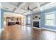 Open floor plan seamlessly connecting the living room, kitchen, and dining area with hardwood floors at 1022 Nestling Dr, Lawrenceville, GA 30045