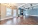 Bright, open-concept living space featuring a fireplace, hardwood floors, and access to kitchen at 1022 Nestling Dr, Lawrenceville, GA 30045
