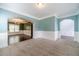 An open-concept living room with carpet, white base trim and wall molding, and archways at 1022 Nestling Dr, Lawrenceville, GA 30045