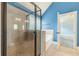 Large tiled shower with a glass enclosure and built in bench at 1022 Nestling Dr, Lawrenceville, GA 30045