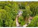 Aerial view of private wooded lot and updated home at end of cul-de-sac at 2552 Hunton Ne Ct, Marietta, GA 30068