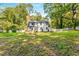 Expansive backyard with lush greenery, mature trees, and well-maintained lawn surrounding the home at 2552 Hunton Ne Ct, Marietta, GA 30068