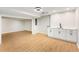 Finished basement featuring vinyl floors, utility sink, and bright white cabinets at 2552 Hunton Ne Ct, Marietta, GA 30068