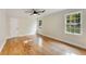 Bedroom with hardwood floors, ceiling fan, and natural light from the windows at 2552 Hunton Ne Ct, Marietta, GA 30068