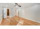 Large bedroom with hardwood floors and multiple doorways, showcasing spaciousness and versatile layout at 2552 Hunton Ne Ct, Marietta, GA 30068