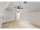 Upstairs bedroom featuring a large window, and a door leading to another area at 2552 Hunton Ne Ct, Marietta, GA 30068
