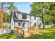 Back exterior view of a two-story home showcasing a wooden deck and a well-maintained backyard at 2552 Hunton Ne Ct, Marietta, GA 30068